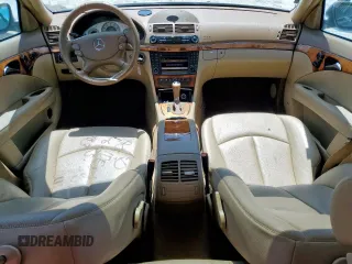2009 Mercedes-Benz E-Class Luxury 3.5L with VIN WDBUF56X09B396917, listed as a Copart auction lot 52769485 with 142,968 mi miles and Salvage Title. Bid and sale history available at carsss.com. Image 8.