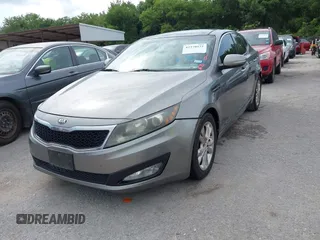 2013 Kia Optima EX z VIN 5XXGN4A73DG127493, wystawiony jako IAAI lot #42370932 z przebiegiem 173 412 mil mil oraz . Historia ofert i sprzedaży dostępna na DreamBid. Obrazek 2.