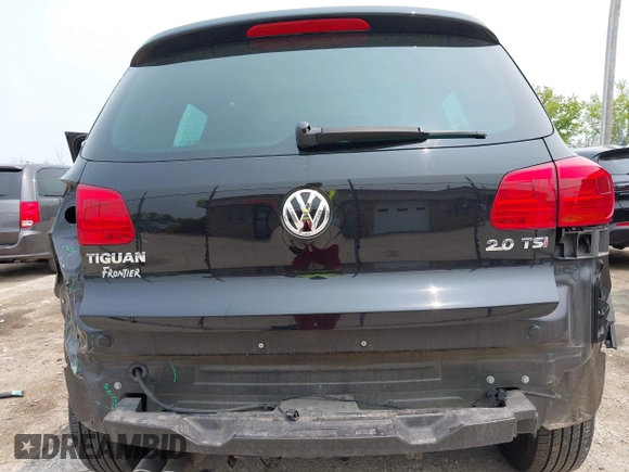 2013 Volkswagen Tiguan S with VIN WVGAV3AX2DW594334, listed as a IAAI auction lot 42405989 with 96,559 mi miles and . Bid and sale history available at DreamBid. Image 6.