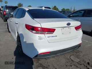 2016 Kia Optima LX with VIN 5XXGT4L33GG014082, listed as a IAAI auction lot 41870030 with 137,849 mi miles and . Bid and sale history available at DreamBid. Image 3.
