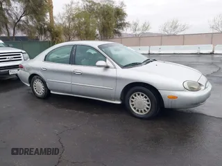 1997 Mercury Sable GS z VIN 1MELM50U8VG603194, wystawiony jako IAAI lot #41558010 z przebiegiem 265 169 mil mil oraz . Historia ofert i sprzedaży dostępna na DreamBid. Obrazek 13.