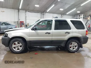 2005 Ford Escape XLT with VIN 1FMYU03115KA29039, listed as a IAAI auction lot 42159988 with 240,047 mi miles and . Bid and sale history available at DreamBid. Image 14.