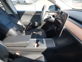 2024 Tesla Model Y Long Range with VIN 7SAYGDEE4RF149457, listed as a IAAI auction lot 41700922 with Not Provided miles. Bid and sale history available at carsss.com. Image 5.