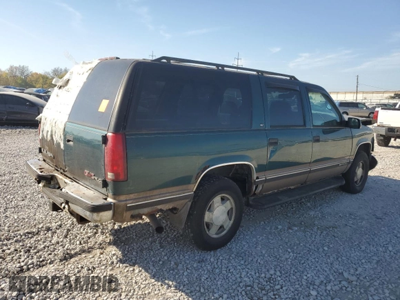 1997 GMC Suburban z VIN 3GKFK16R7VG514905, wystawiony jako Copart lot #77410934 z przebiegiem 193 116 mil mil oraz Szkoda całkowita • Salvage title. Historia ofert i sprzedaży dostępna na DreamBid. Obrazek 3.