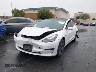2020 Tesla Model 3 Standard Range Plus with VIN 5YJ3E1EA2LF740225, listed as a IAAI auction lot 41781554 with 46,703 mi miles. Bid and sale history available at carsss.com. Image 2.