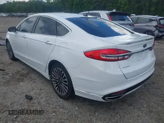 2017 Ford Fusion Titanium z VIN 3FA6P0K93HR203063, wystawiony jako IAAI lot #42243064 z przebiegiem 176 078 mil mil oraz . Historia ofert i sprzedaży dostępna na DreamBid. Obrazek 3.