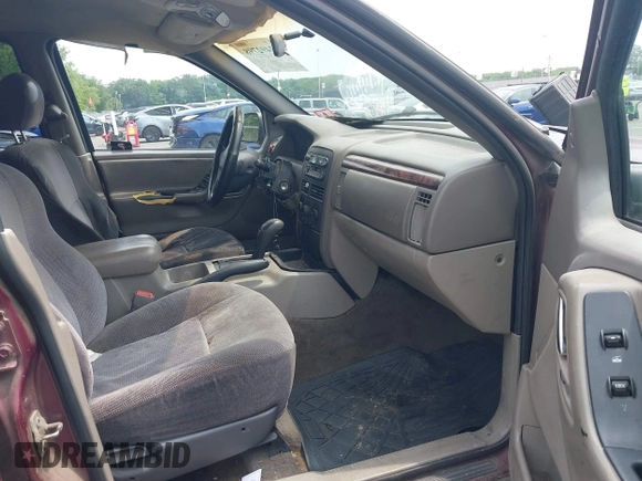2000 Jeep Grand Cherokee Laredo z VIN 1J4GW48S2YC288439, wystawiony jako IAAI lot #42492798 z przebiegiem 272 527 mil mil oraz . Historia ofert i sprzedaży dostępna na DreamBid. Obrazek 5.