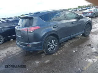 2016 Toyota RAV4 LE with VIN JTMZFREV5GJ097330, listed as a IAAI auction lot 41884397 with 107,699 mi miles. Bid and sale history available at carsss.com. Image 4.