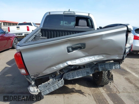 2018 Toyota Tacoma SR5 with VIN 3TMAZ5CN0JM053861, listed as a IAAI auction lot 41920377 with 104,015 mi miles and . Bid and sale history available at DreamBid. Image 6.