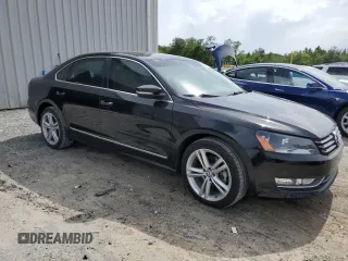 2014 Volkswagen Passat SE with VIN 1VWBN7A35EC094262, listed as a Copart auction lot 60287965 with 71,081 mi miles and Salvage title. Bid and sale history available at DreamBid. Image 4.