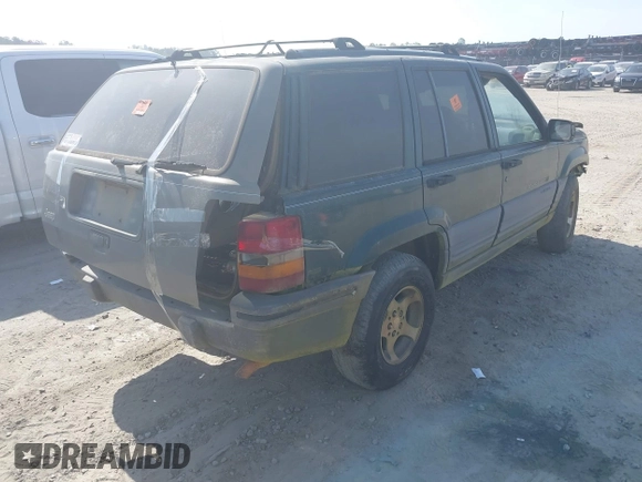 1996 Jeep Grand Cherokee Laredo with VIN 1J4FX58S9TC300710, listed as a IAAI auction lot 42073391 with 1 mi miles. Bid and sale history available at carsss.com. Image 4.
