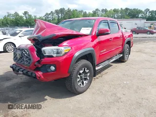 2021 Toyota Tacoma SR z VIN 5TFCZ5AN2MX263159, wystawiony jako IAAI lot #42273087 z przebiegiem 69 220 mil mil oraz . Historia ofert i sprzedaży dostępna na DreamBid. Obrazek 2.