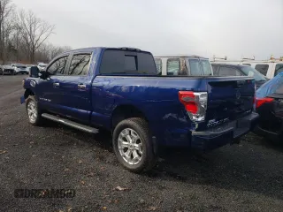 2017 Nissan Titan XD PRO-4X with VIN 1N6AA1F43HN504281, listed as a Copart auction lot 82169004 with 76,811 mi miles and Salvage Title. Bid and sale history available at carsss.com. Image 2.