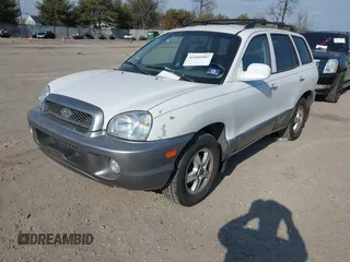 2002 Hyundai Santa Fe GLS with VIN KM8SC73D32U249942, listed as a IAAI auction lot 41660482 with 151,164 mi miles. Bid and sale history available at carsss.com. Image 2.