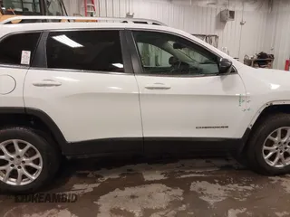 2014 Jeep Cherokee Latitude with VIN 1C4PJMCS4EW318353, listed as a IAAI auction lot 41945598 with 179,425 mi miles and . Bid and sale history available at DreamBid. Image 13.