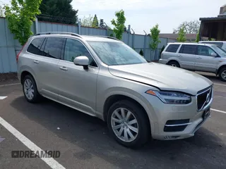 2016 Volvo XC90 T6 Momentum with VIN YV4A22PK7G1038750, listed as a IAAI auction lot 42128057 with 124,112 mi miles. Bid and sale history available at carsss.com. Image 1.