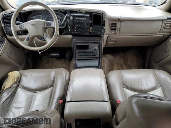 2003 GMC Yukon Denali z VIN 1GKEK63U43J263449, wystawiony jako Copart lot #53848345 z przebiegiem 144 280 mil mil oraz Szkody całkowita. Historia ofert i sprzedaży dostępna na DreamBid. Obrazek 8.