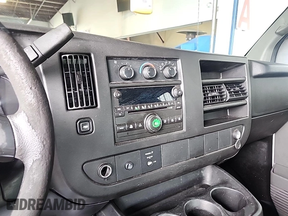2013 Chevrolet Express Cargo Van with VIN 1GCWGFCA4D1137326, listed as a IAAI auction lot 42194387 with 214,260 mi miles. Bid and sale history available at carsss.com. Image 1.