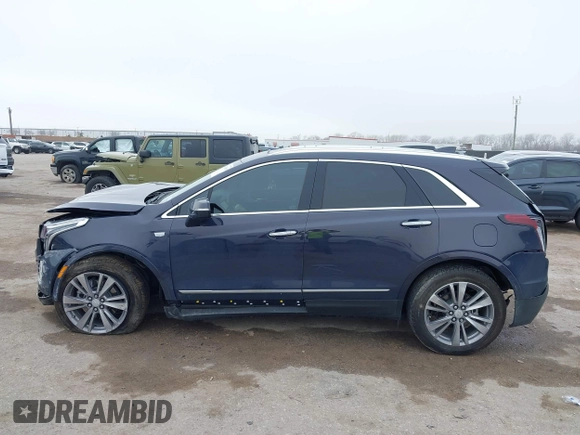 2024 Cadillac XT5 FWD Premium Luxury with VIN 1GYKNCR47RZ755652, listed as a IAAI auction lot 41512069 with 10,243 mi miles. Bid and sale history available at carsss.com. Image 14.
