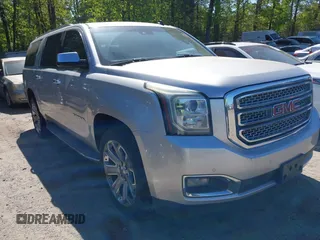 2015 GMC Yukon XL SLT with VIN 1GKS1HKC8FR221608, listed as a IAAI auction lot 42044318 with 215,757 mi miles. Bid and sale history available at carsss.com. Image 1.