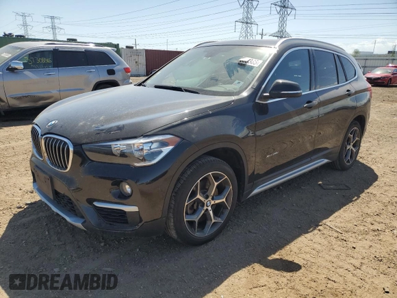 2018 BMW X1 xDrive28i with VIN WBXHT3C38J5K28174, listed as a Copart auction lot 57333385 with 50,064 mi miles and Salvage title. Bid and sale history available at DreamBid. Image 1.