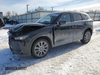2021 Mazda CX-5 Grand Touring with VIN JM3KFBDM5M1456650, listed as a Copart auction lot 42124045 with 45,205 mi miles and Salvage Title. Bid and sale history available at carsss.com. Image 1.