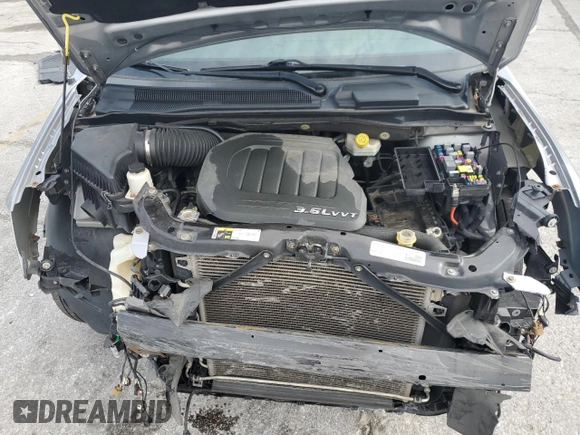 2014 Chrysler Town & Country Touring L z VIN 2C4RC1CG3ER200123, wystawiony jako Copart lot #52604085 z przebiegiem 146 761 mil mil oraz Szkoda całkowita • Salvage title. Historia ofert i sprzedaży dostępna na DreamBid. Obrazek 14.