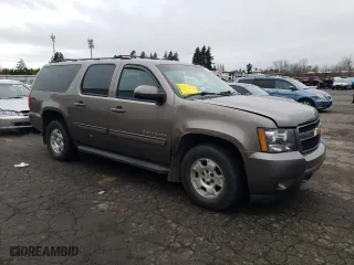2013 Chevrolet Suburban LT with VIN 1GNSKJE7XDR101702, listed as a Copart auction lot 45577695 with 182,576 mi miles and Salvage Title. Bid and sale history available at carsss.com. Image 4.