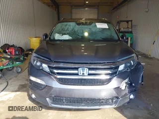 2017 Honda Pilot Touring with VIN 5FNYF6H91HB084737, listed as a IAAI auction lot 41608145 with 86,696 mi miles. Bid and sale history available at carsss.com. Image 12.
