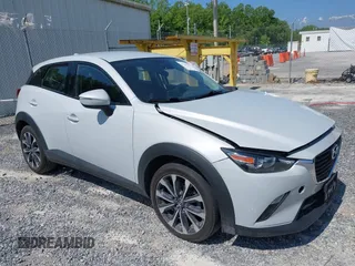 2019 Mazda CX-3 Touring z VIN JM1DKFC78K0403122, wystawiony jako IAAI lot #42190486 z przebiegiem 97 031 mil mil oraz . Historia ofert i sprzedaży dostępna na DreamBid. Obrazek 1.