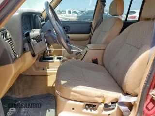 1999 Jeep Cherokee Sport с VIN 1J4FT68S5XL675839, выставлен на аукционе Copart как лот 65230005 с пробегом 204 102 миль миль и Списание • Salvage title. История ставок и продаж доступна на DreamBid. Изображение 7.