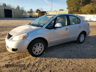2012 Suzuki SX4 LE with VIN JS2YC5A38C6300439, listed as a Copart auction lot 85121124 with 74,324 mi miles and Clean Title. Bid and sale history available at carsss.com. Image 1.