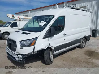 2023 Ford Transit Cargo z VIN 1FTYE1CG2PKB14938, wystawiony jako IAAI lot #41964017 z przebiegiem 6 902 mil mil oraz . Historia ofert i sprzedaży dostępna na DreamBid. Obrazek 22.
