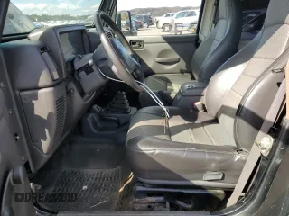 1999 Jeep Wrangler Sport z VIN 1J4FY19SXXP465037, wystawiony jako Copart lot #54772405 z przebiegiem 50 942 mil mil oraz Nie do naprawy • Non repairable. Historia ofert i sprzedaży dostępna na DreamBid. Obrazek 7.