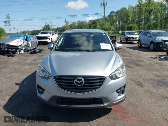 2016 Mazda CX-5 Touring z VIN JM3KE4CY4G0646114, wystawiony jako IAAI lot #42269181 z przebiegiem 58 252 mil mil oraz . Historia ofert i sprzedaży dostępna na DreamBid. Obrazek 13.