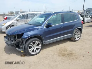 2012 Volkswagen Tiguan SEL with VIN WVGAV7AX8CW536752, listed as a IAAI auction lot 41798619 with 128,223 mi miles and . Bid and sale history available at DreamBid. Image 2.