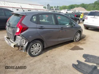 2015 Honda Fit LX with VIN 3HGGK5H58FM722880, listed as a IAAI auction lot 42276261 with 104,886 mi miles and . Bid and sale history available at DreamBid. Image 4.