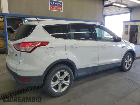 2016 Ford Escape SE с VIN 1FMCU9GX8GUA99979, выставлен на аукционе Copart как лот 57623295 с пробегом 124 813 миль миль и Списание • Salvage title. История ставок и продаж доступна на DreamBid. Изображение 3.