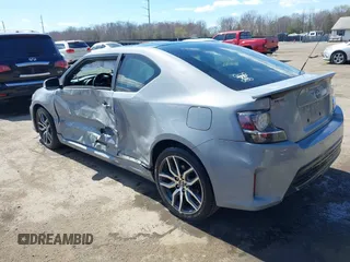 2014 Scion tC with VIN JTKJF5C70E3083839, listed as a IAAI auction lot 41886711 with 118,029 mi miles. Bid and sale history available at carsss.com. Image 3.