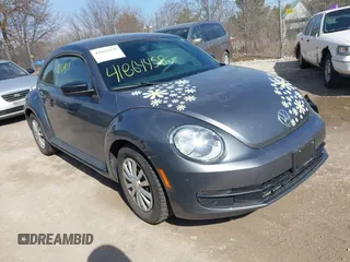 2012 Volkswagen Beetle Entry PZEV with VIN 3VWFP7AT7CM644732, listed as a IAAI auction lot 41864458 with 134,073 mi miles. Bid and sale history available at carsss.com. Image 1.