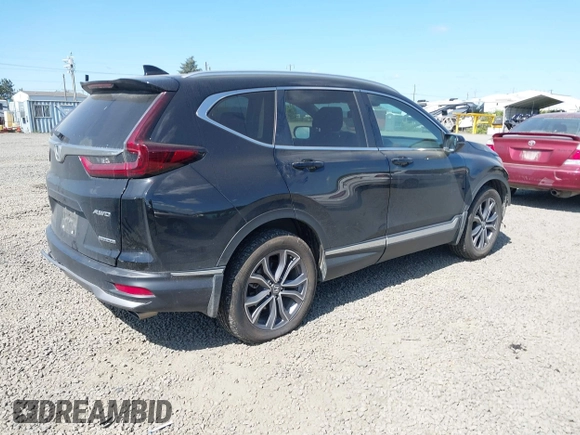 2021 Honda CR-V Touring with VIN 2HKRW2H96MH681908, listed as a IAAI auction lot 42082535 with 65,570 mi miles and . Bid and sale history available at DreamBid. Image 4.