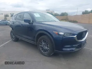 2021 Mazda CX-5 Touring with VIN JM3KFACM9M0410031, listed as a IAAI auction lot 41949116 with 34,907 mi miles. Bid and sale history available at carsss.com. Image 1.