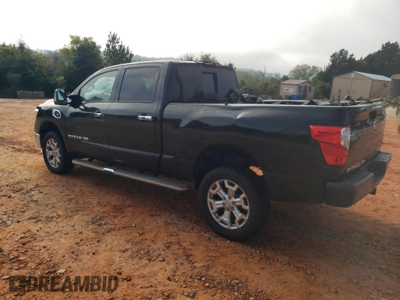 2016 Nissan Titan XD PRO-4X with VIN 1N6BA1F45GN506648, listed as a Copart auction lot 74381534 with 154,114 mi miles and Salvage Title. Bid and sale history available at carsss.com. Image 2.