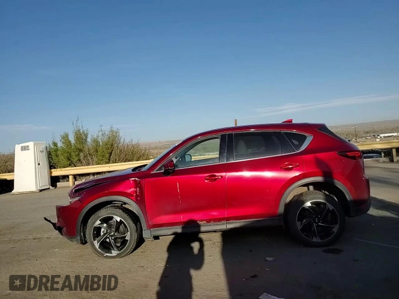 2018 Mazda CX-5 Grand Touring z VIN JM3KFBDMXJ0390680, wystawiony jako Copart lot #51654345 z przebiegiem 67 167 mil mil oraz Szkoda całkowita • Salvage title. Historia ofert i sprzedaży dostępna na DreamBid. Obrazek 12.