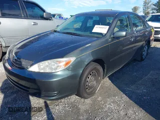 2003 Toyota Camry LE with VIN 4T1BE32KX3U689421, listed as a IAAI auction lot 41566812 with 192,673 mi miles and . Bid and sale history available at DreamBid. Image 2.