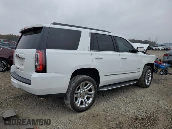 2019 GMC Yukon SLT with VIN 1GKS2BKC2KR338007, listed as a Copart auction lot 82336394 with 105,087 mi miles and Salvage Title. Bid and sale history available at carsss.com. Image 3.