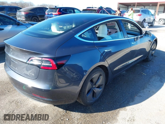 2018 Tesla Model 3 Long Range Battery with VIN 5YJ3E1EB6JF122167, listed as a IAAI auction lot 41761710 with 76,199 mi miles and . Bid and sale history available at DreamBid. Image 4.