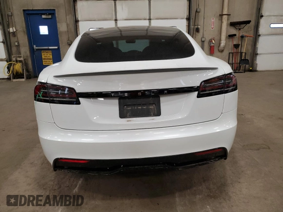 2023 Tesla Model S с VIN 5YJSA1E5XPF520265, выставлен на аукционе Copart как лот 54833255 с пробегом 16 502 миль миль и Списание • Salvage title. История ставок и продаж доступна на DreamBid. Изображение 6.