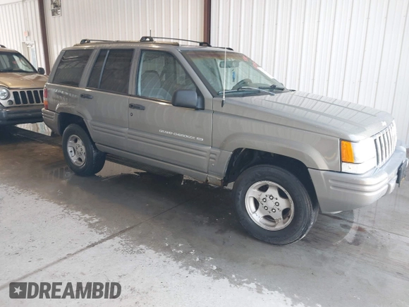 1998 Jeep Grand Cherokee Laredo with VIN 1J4GZ48S4WC262249, listed as a IAAI auction lot 42739473 with 94,094 mi miles and . Bid and sale history available at DreamBid. Image 1.