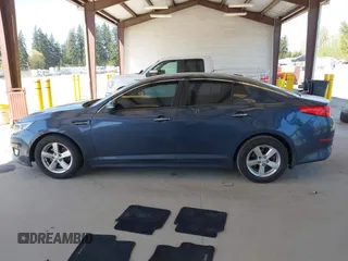 2015 Kia Optima LX with VIN KNAGM4A70F5592109, listed as a IAAI auction lot 42053533 with 159,401 mi miles. Bid and sale history available at carsss.com. Image 14.